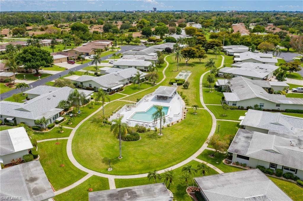 Aerial view of 24 unit community with a pool