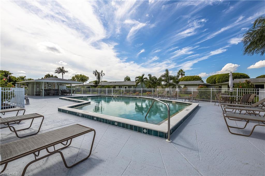 Community pool with a patio