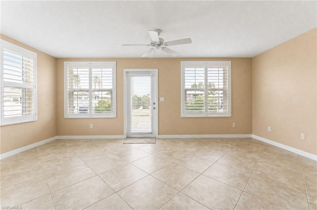 Fabulous lanai/den/extra room. Virtually removed clutter/furniture and lightened wall color.