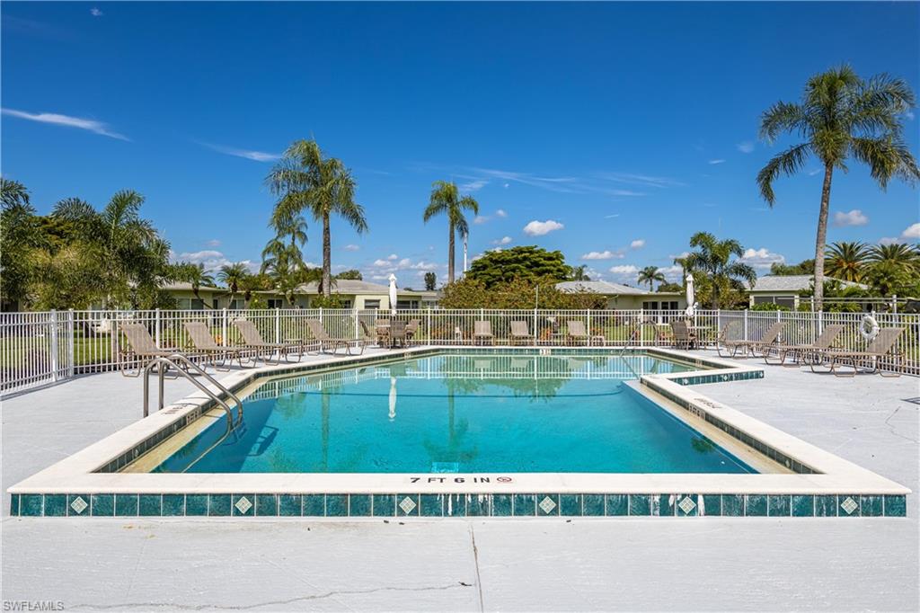 Community pool featuring a patio