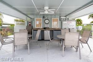 View of patio / terrace featuring outdoor dining area and ceiling fan