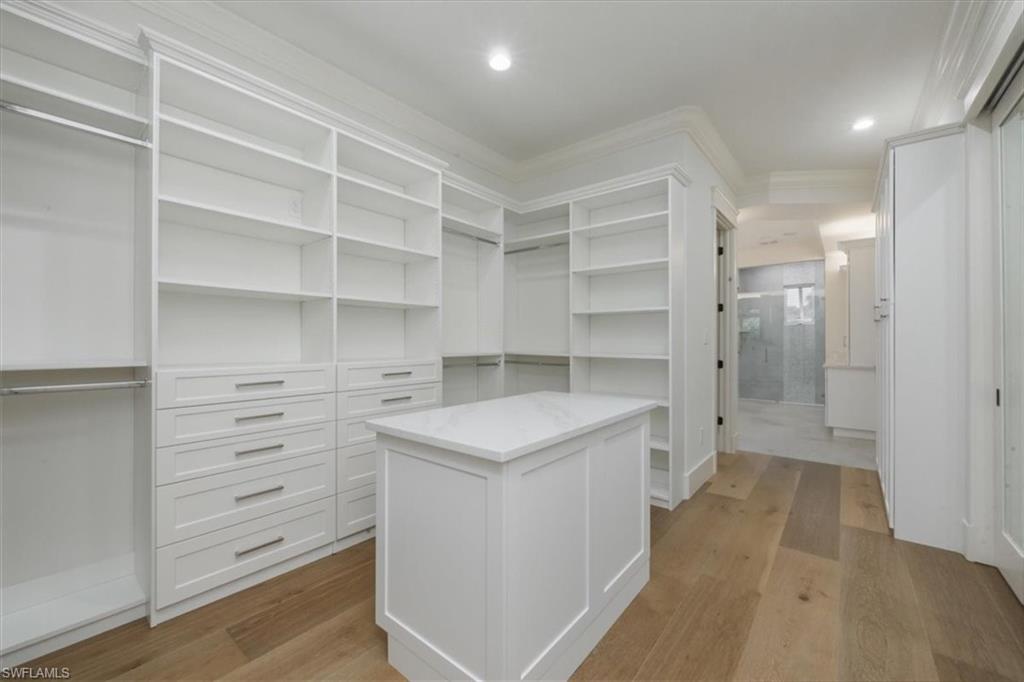 Walk in closet featuring light wood finished floors