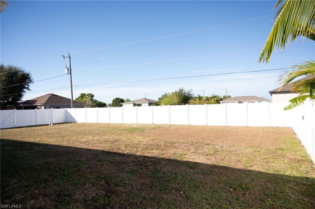 View of fenced backyard