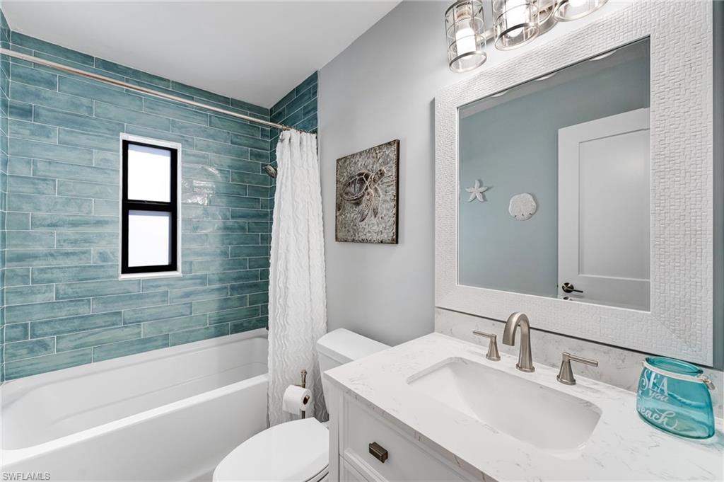 Guest Full bathroom featuring vanity and shower / tub combo
