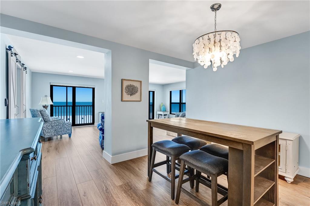 Dining room with a chandelier, and a view of the Gulf