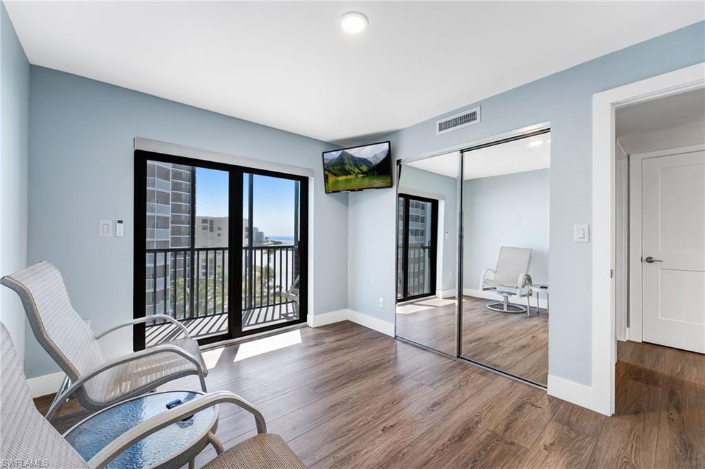Guest bedroom featuring a nice size screened private balcony, wood finished floors and recessed lighting