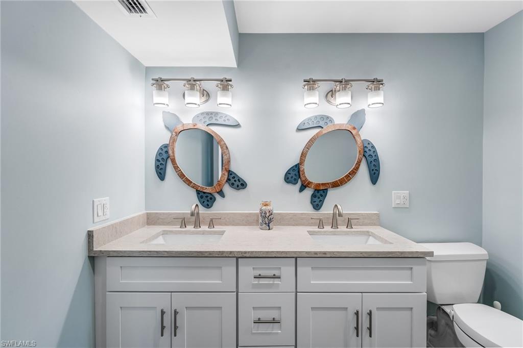 Master Full bathroom with double vanity and toilet
