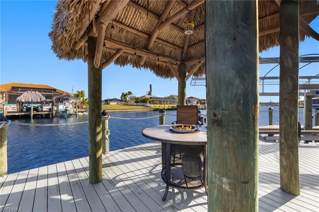 Dock area featuring a water view and boat lift