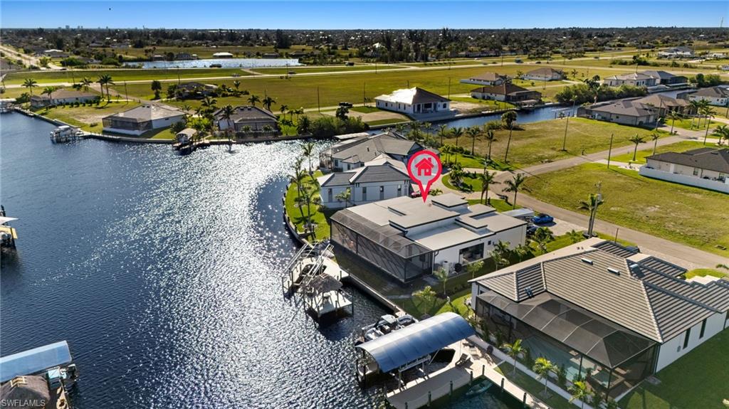 Aerial perspective of suburban area with a nearby body of water