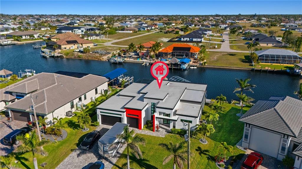 Aerial view of residential area with a nearby body of water