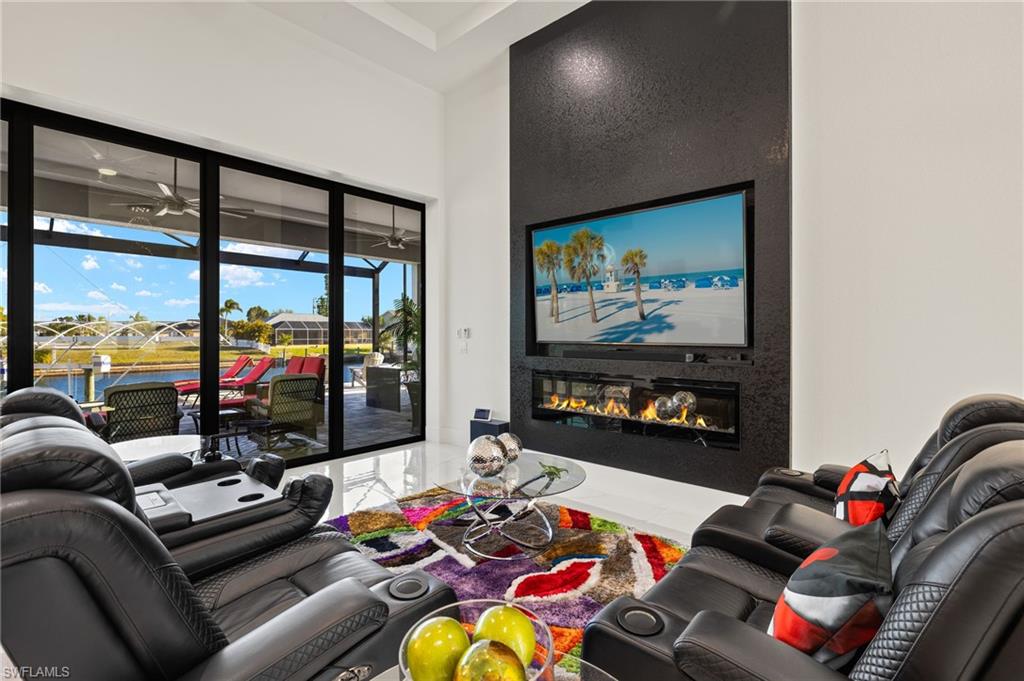 Living room featuring a glass covered fireplace