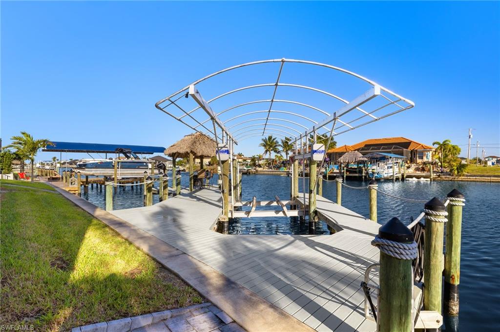 Dock with boat lift and a water view