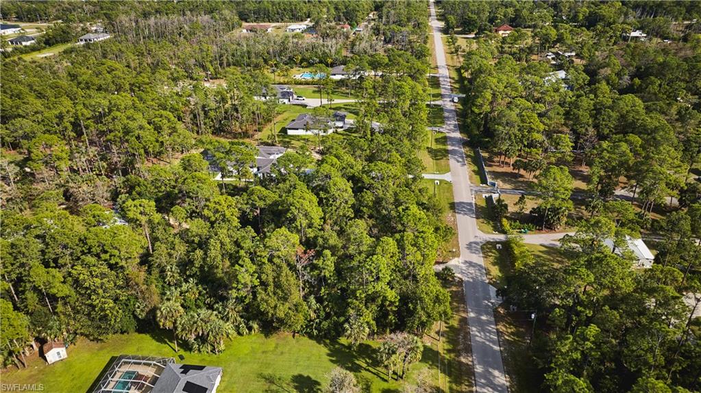 Aerial overview of property's location featuring a forest