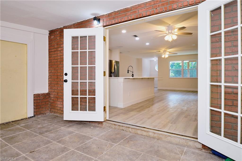 Unfurnished room with brick wall