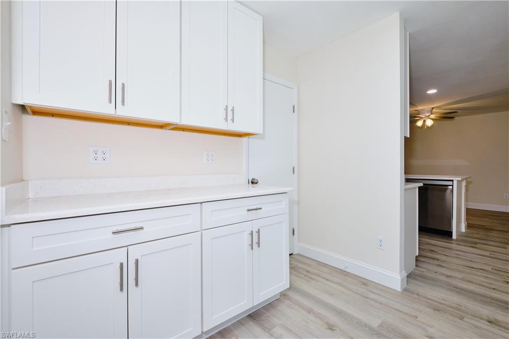Kitchen featuring white cabinetry, light wood finished floors, dishwasher, recessed lighting, and ceiling fan