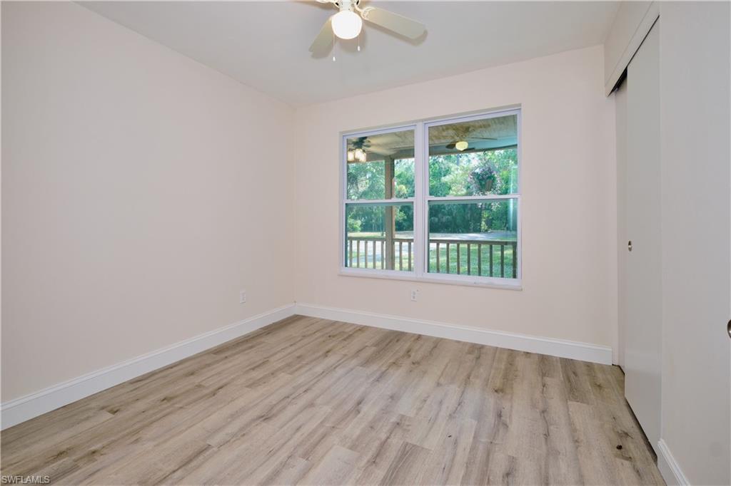 Unfurnished room with baseboards and light wood finished floors