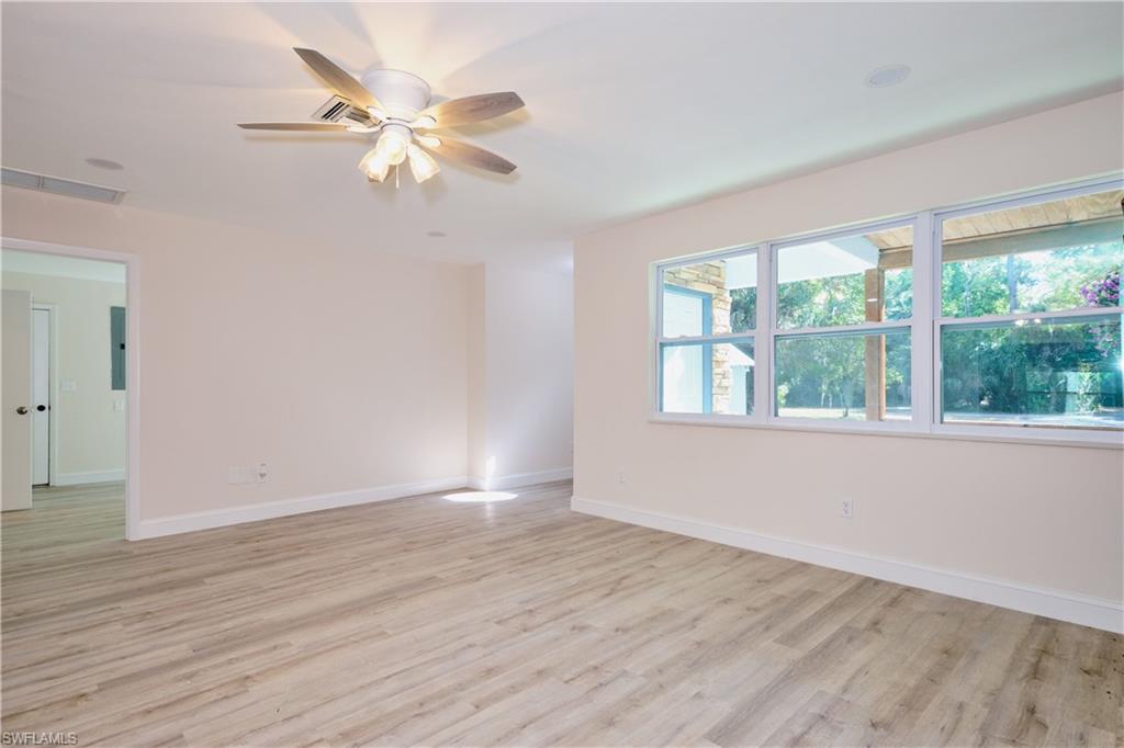 Spare room with light wood-style floors and ceiling fan