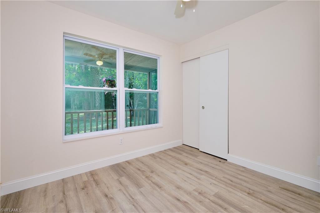 Spare room featuring wood finished floors and ceiling fan