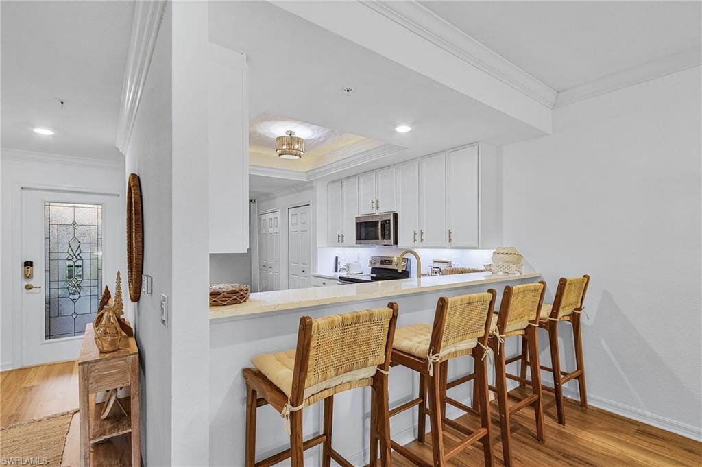 Breakfast bar overlooks kitchen area