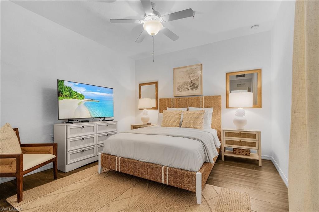 Bedroom with ceiling fan and light hardwood / wood-style flooring