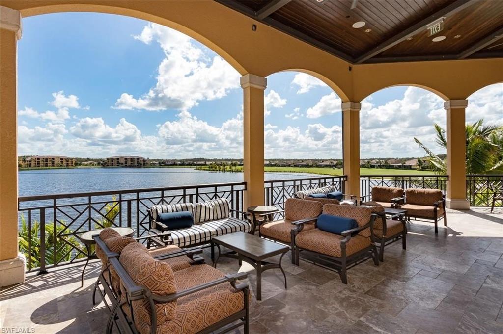 View of patio with an outdoor hangout area, a water view, and a balcony