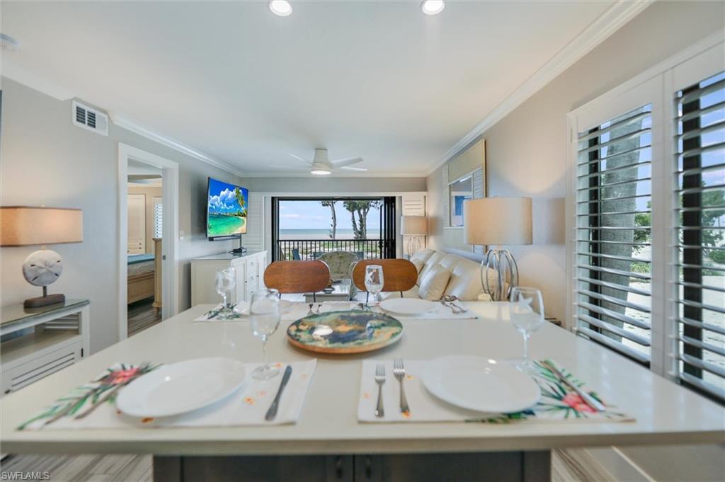 Dining room featuring crown molding and ceiling fan