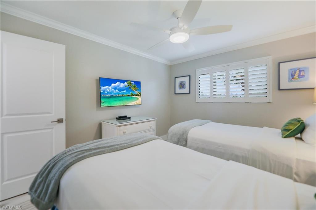 Bedroom featuring crown molding and ceiling fan