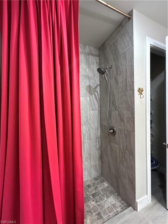 Bathroom with a tile shower and toilet