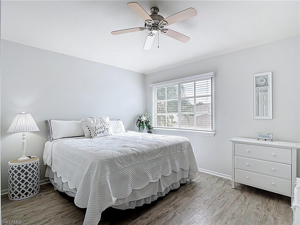 Bedroom with light wood-type flooring and ceiling fan
