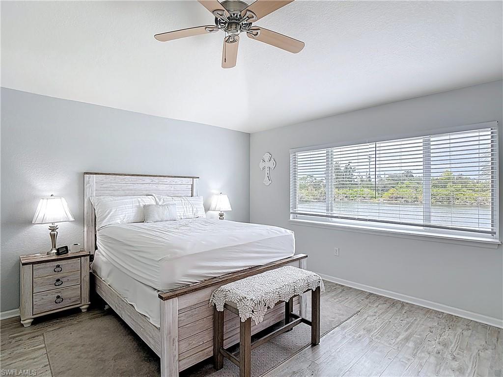 Bedroom featuring a ceiling fan and light wood-type flooring