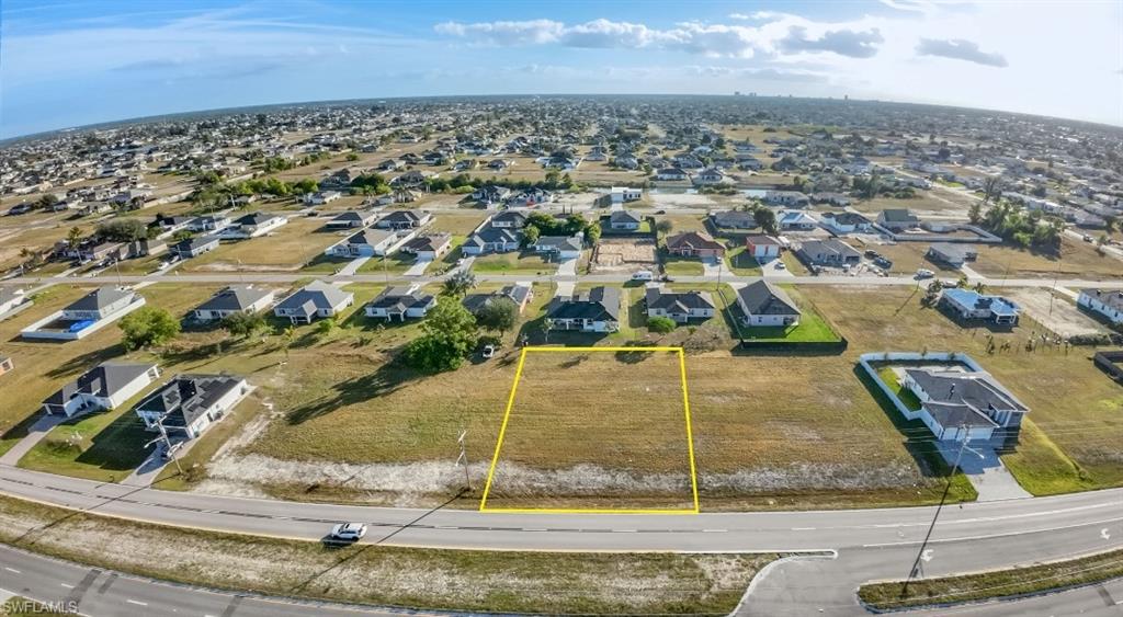 Aerial view of residential area with property boundaries highlighted