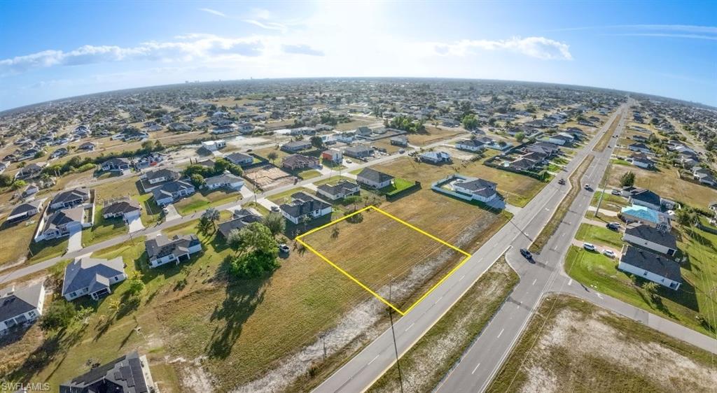 Aerial perspective of suburban area featuring property parcel outlined