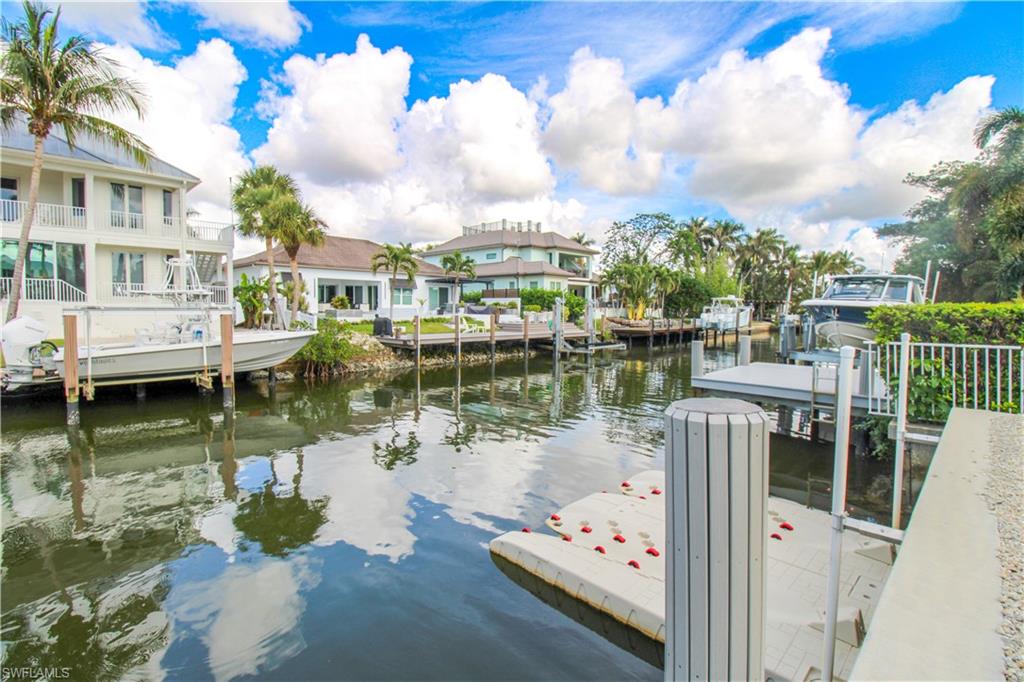 Dock area featuring a water view