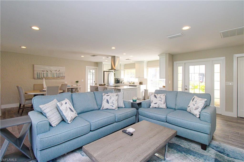 Living room with light hardwood / wood-style flooring