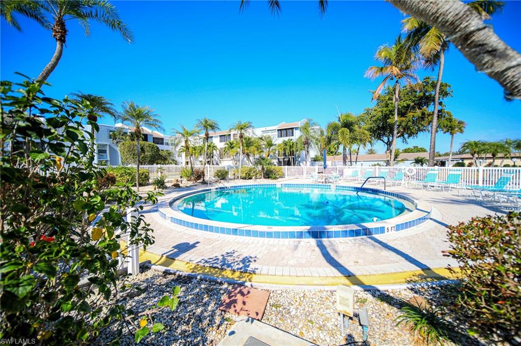 Community pool featuring a patio