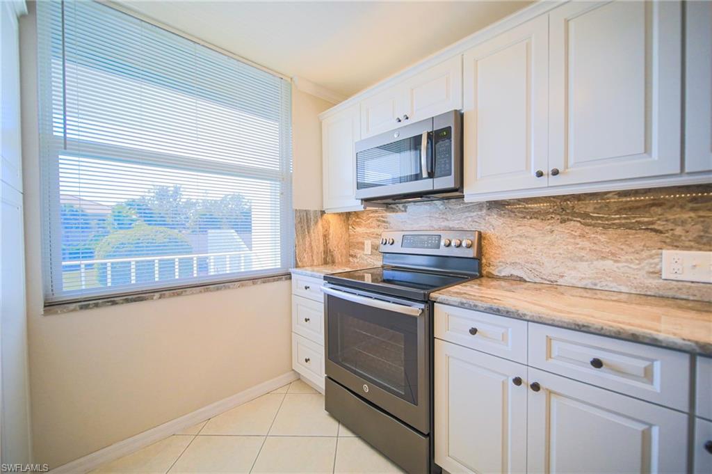This Updated Kitchen Features Stainless Steel Appliances, Granite Countertops And Backsplash, White Wooden Cabinets & Drawers, A Large Pantry, A Passthrough To The Dining Room, And Lots Of Natural Lighting!