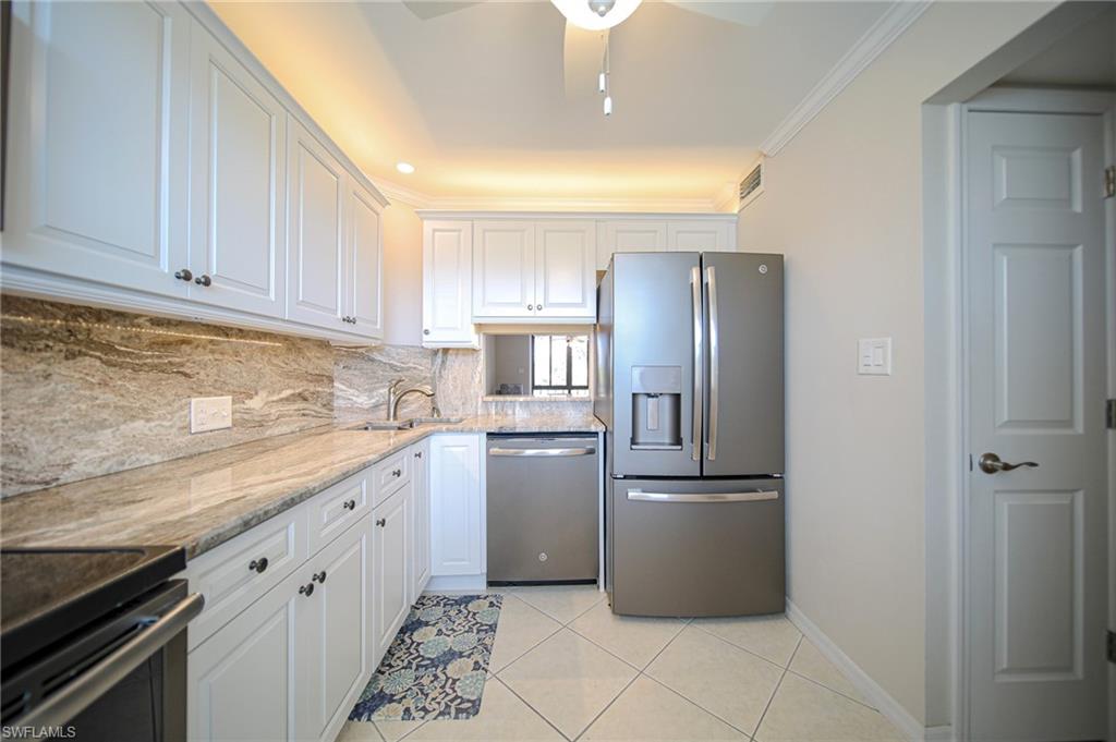 This Updated Kitchen Features Stainless Steel Appliances, Granite Countertops And Backsplash, White Wooden Cabinets & Drawers, A Large Pantry, A Passthrough To The Dining Room, And Lots Of Natural Lighting!