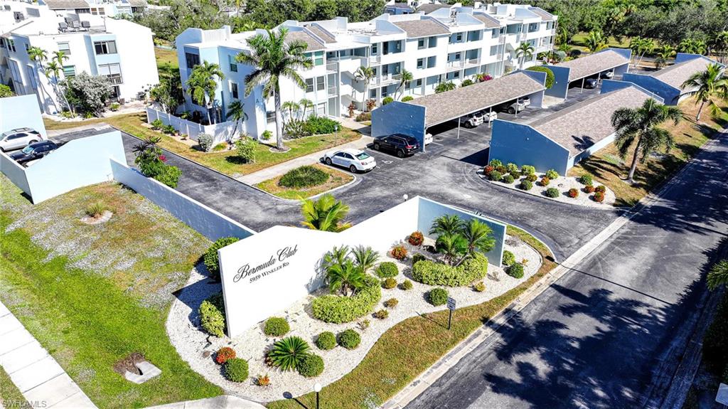Aerial View Of Complex Entry, Parking, And Building!
