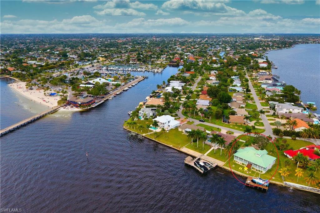 Aerial view of residential area featuring a large body of water