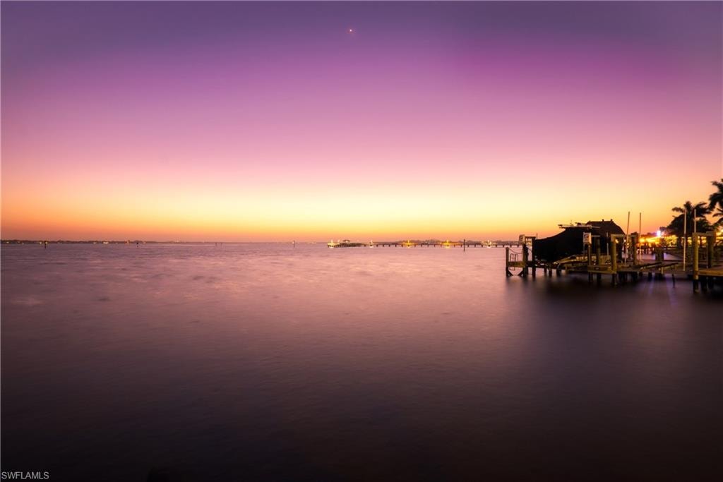 Water view featuring a dock and boat lift