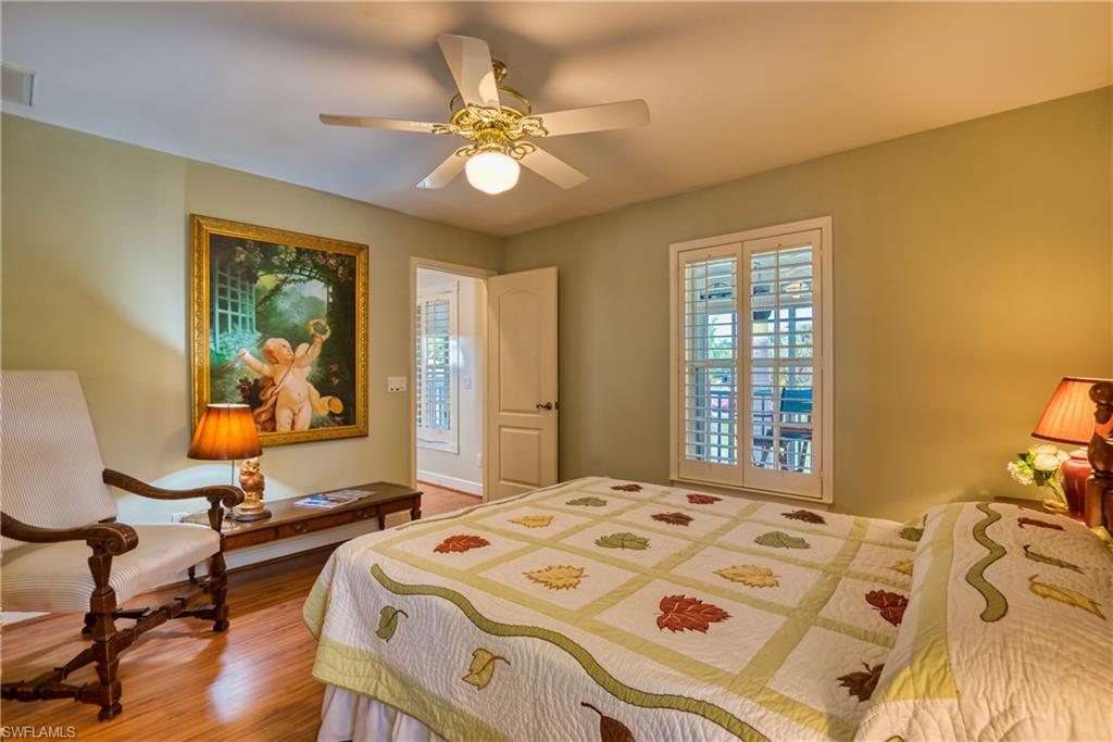 Bedroom featuring wood finished floors and ceiling fan