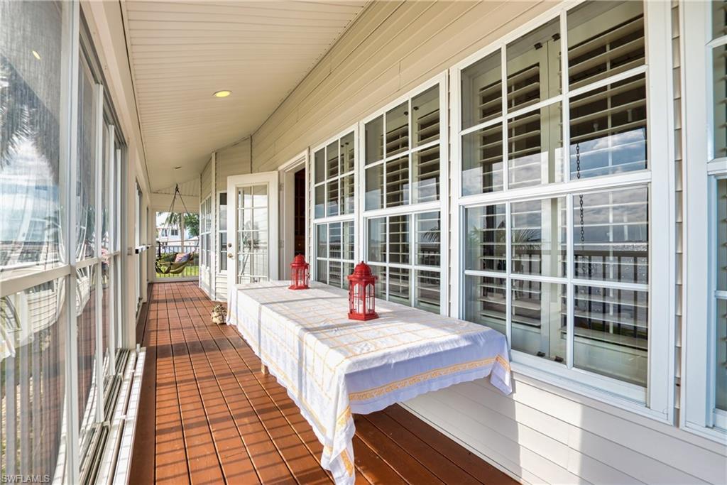 Sunroom / solarium featuring recessed lighting and wood walls