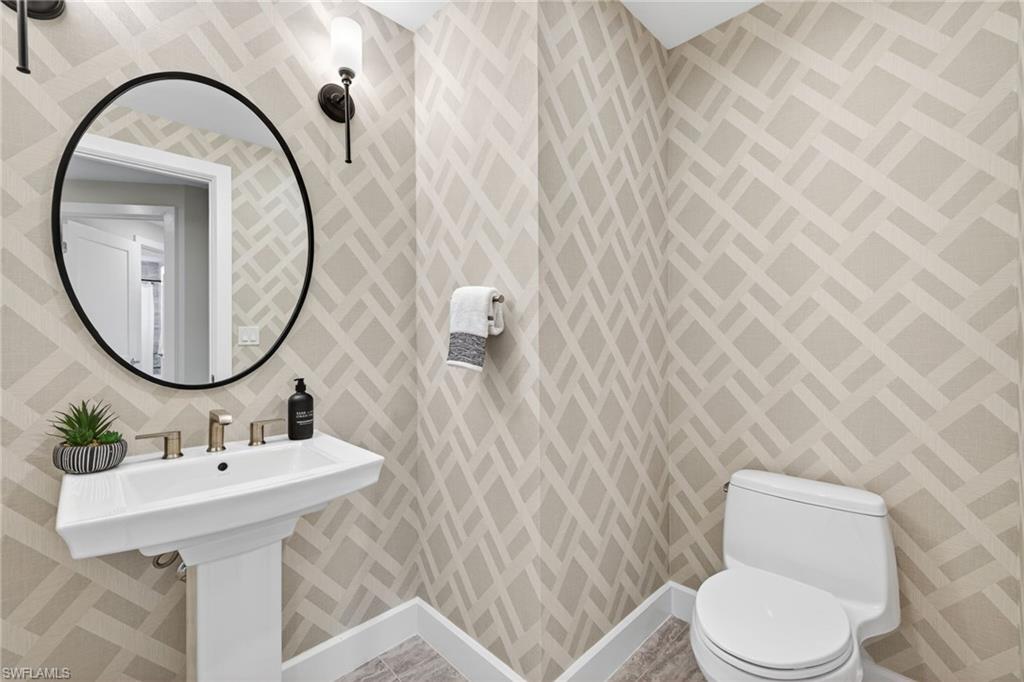 Guest powder bathroom simple coastal decor with contemporary wall paper design