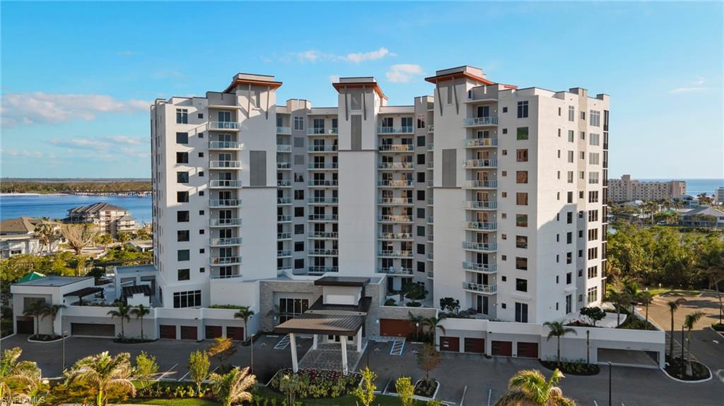 Waterfront building exterior showcasing modern coastal architecture and sweeping bay views.