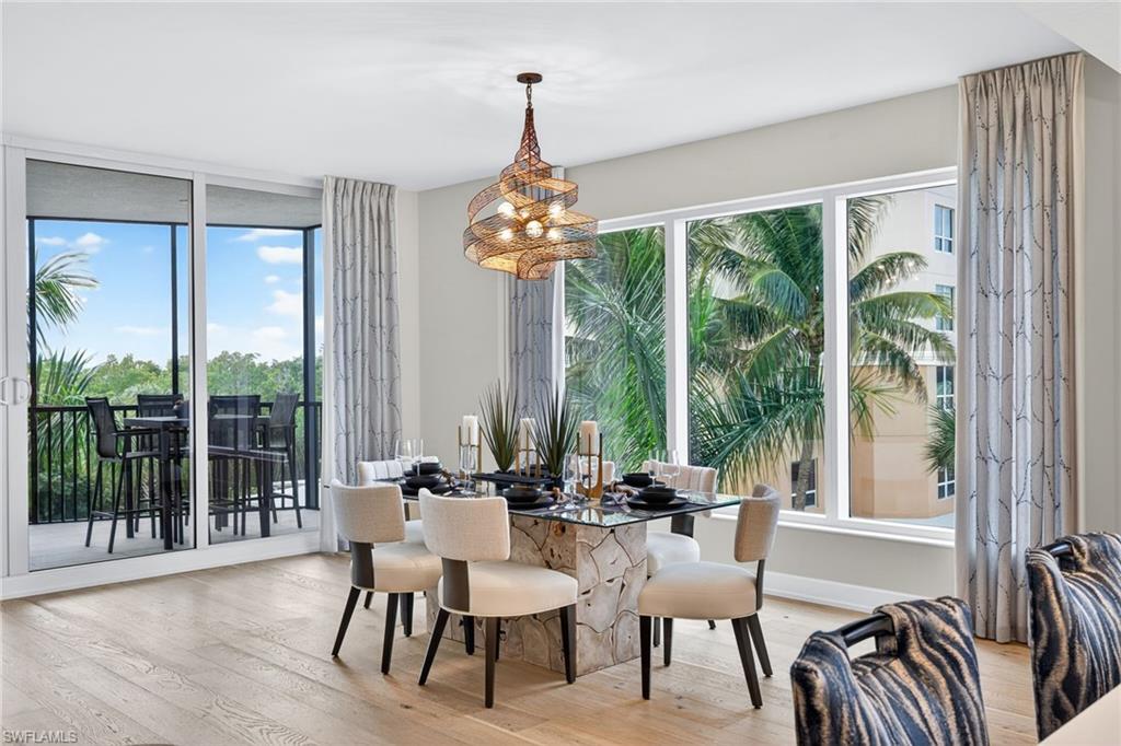 Dining area plenty of natural light , views of  tropical trees and gorgeous skyline