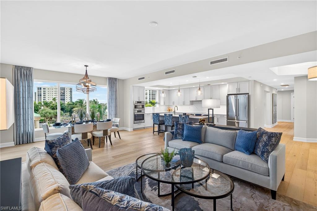 Open living room, dining room and kitchen space has large open flow for family gatherings and entertaining