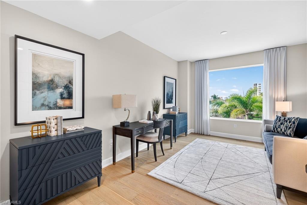 Spacious Den/flex space featuring large window making for a bright airy space to enjoy