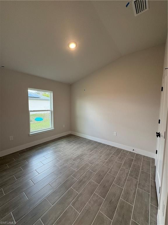 Unfurnished room featuring wood tiled floors and recessed lighting