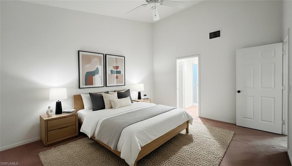 Bedroom with carpet floors, a high ceiling, and ceiling fan
