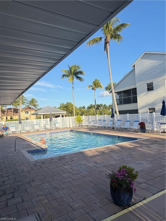 Community pool featuring a patio area